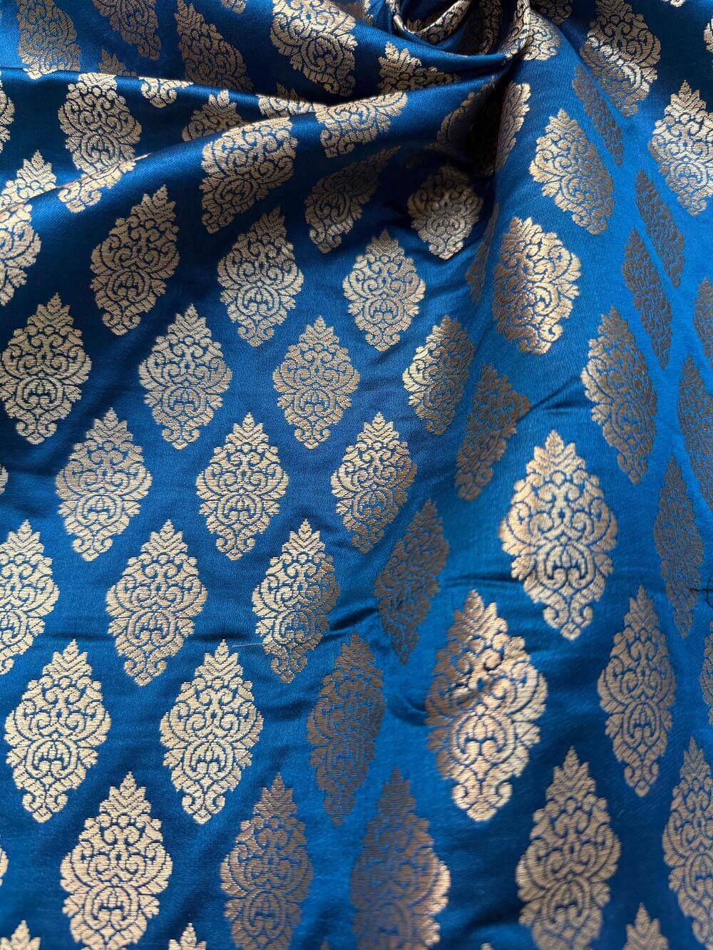 SATIN BROCADE BOOTA FABRIC – PEACOCK BLUE (ZARI SILK WEAVE, PER METER)