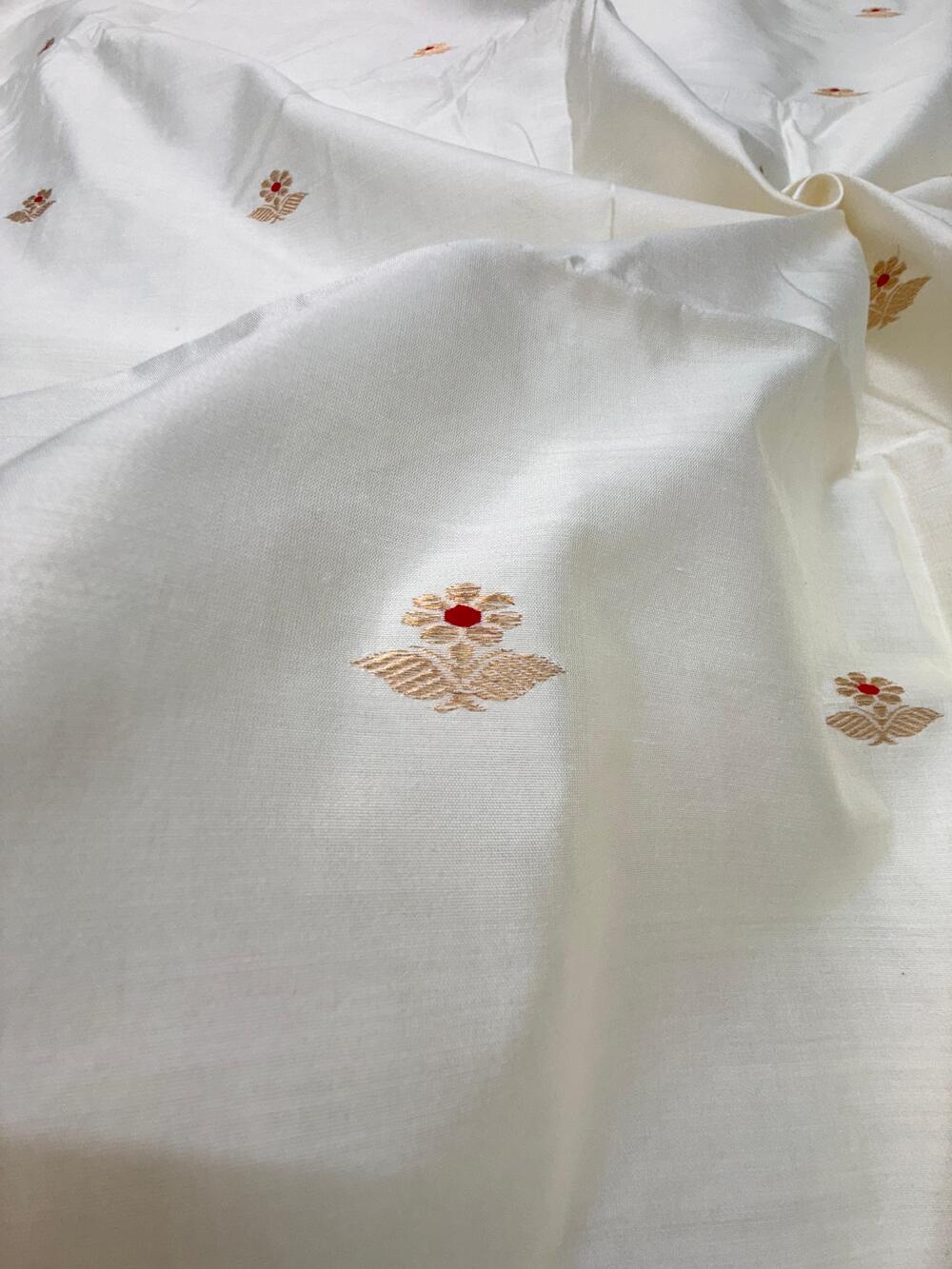 HANDLOOM CHINIYA SILK FABRIC – IVORY CREAM (KADHUWA BOOTA, GOLDEN ZARI WITH MEENAKARI, DYEABLE – PER METER)
