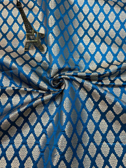 SATIN BROCADE BOOTA FABRIC – PEACOCK BLUE (ZARI SILK WEAVE, PER METER)