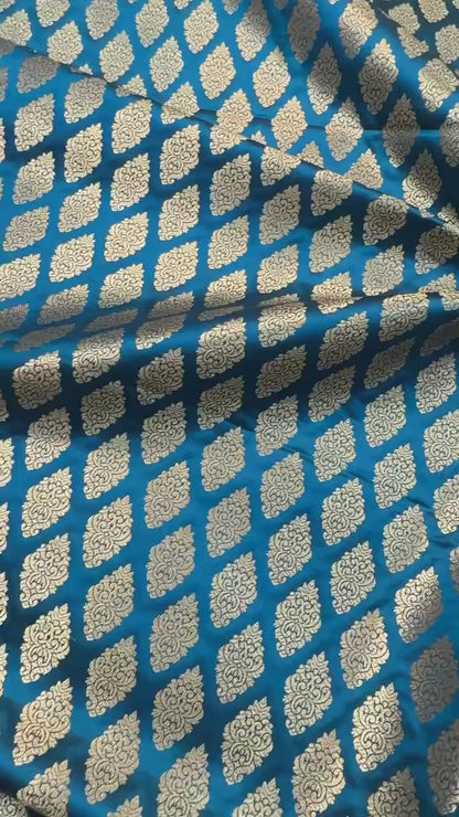 SATIN BROCADE BOOTA FABRIC – PEACOCK BLUE (ZARI SILK WEAVE, PER METER)